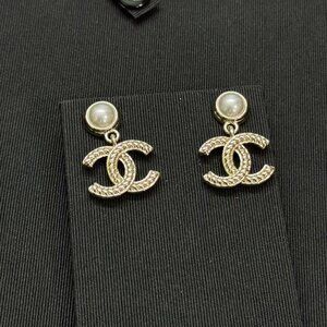 Chanel round pearl double c button earrings